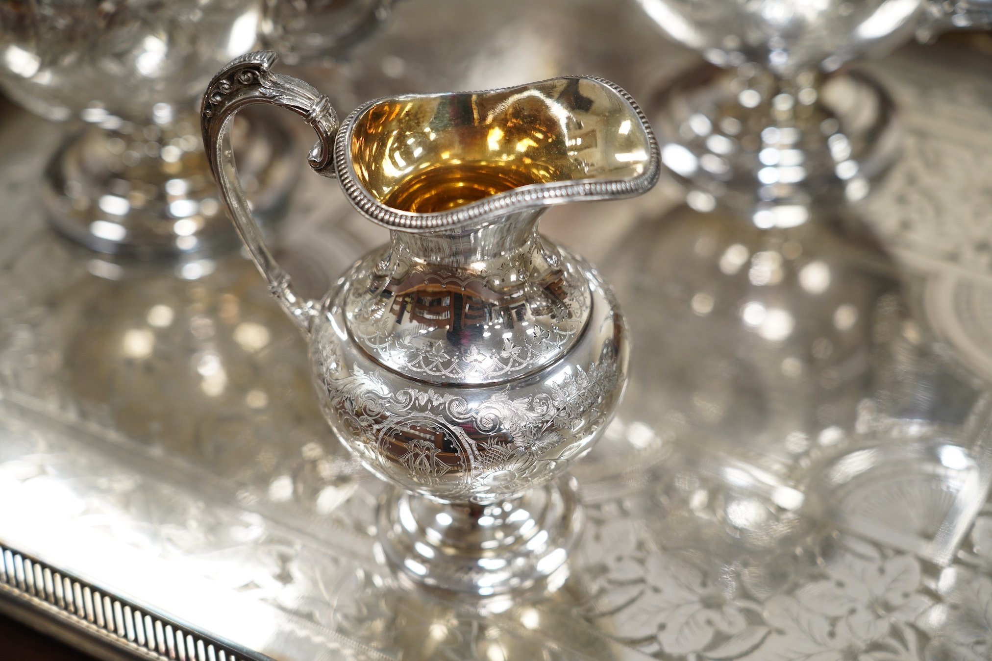 A Victorian four piece plated teaset and a tray. CITES Submission reference 6R2FT6J1. Condition - good